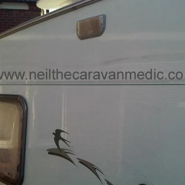 Dent in aluminium caravan